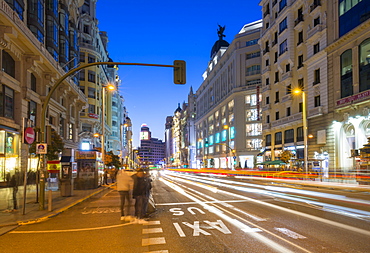 View of architecture and trail lights on Gran Via at dusk, Madrid, Spain, Europe