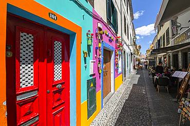 View of back street colourful doors and restaurant, Funchal, Madeira, Portugal, Atlantic, Europe