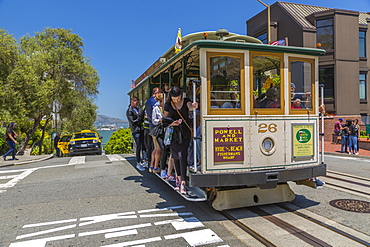 View of Hyde Street cable car and Alcatraz in background, San Francisco, California, United States of America, North America