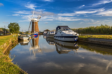 Boats and Horsey Mill reflecting in water, Norfolk Broads, Norfolk, England, United Kingdom, Europe