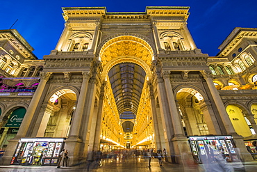 View of Galleria Vittorio Emanuele II in Piazza Del Duomo illuminated at dusk, Milan, Lombardy, Italy, Europe