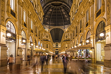 View of the interior of Galleria Vittorio Emanuele II illuminated at dusk, Milan, Lombardy, Italy, Europe