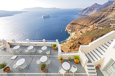 View of Fira white washed houses, harbour and cruise ship, Firostefani, Santorini (Thira), Cyclades Islands, Greek Islands, Greece, Europe