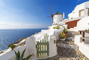 View of windmill overlooking Oia village, Santorini, Cyclades, Aegean Islands, Greek Islands, Greece, Europe