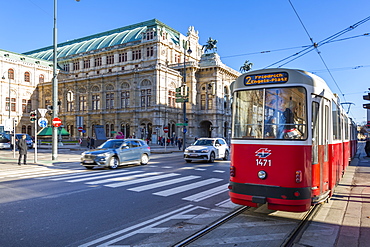 View of Royal Opera House and city tram on Opernring, Vienna, Austria, Europe