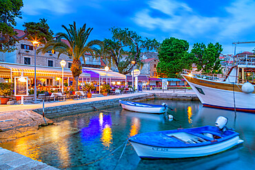 View of restaurants and harbour boats at dusk, Cavtat on the Adriatic Sea, Cavtat, Dubrovnik Riviera, Croatia, Europe