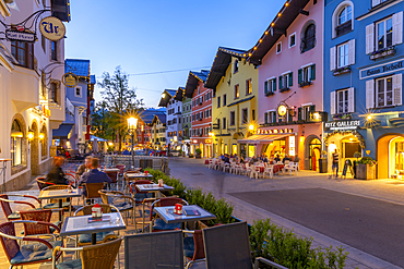 View of architecture and cafes on Vorderstadt at dusk, Kitzbuhel, Austrian Tyrol Region, Austria, Europe