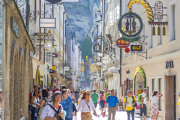 View of shoppers and signs on Getreidegasse, Salzburg, Austria, Europe