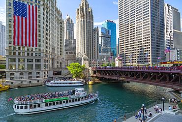 View of American flag on the Wrigley Building and Chicago River, Chicago, Illinois, United States of America, North America