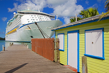 Colourful building and cruise ship in port, St. Johns, Antigua, Leeward Islands, West Indies, Caribbean, Central America