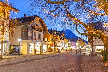 View of town shops at dusk, Garmisch-Partenkirchen, Bavaria, Germany, Europe