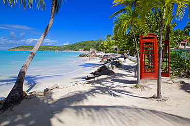 Beach and red telephone box, Dickenson Bay, St. Georges, Antigua, Leeward Islands, West Indies, Caribbean, Central America