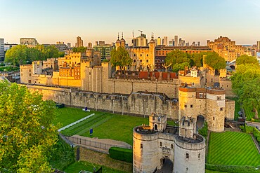 View of the Tower of London, UNESCO World Heritage Site, from Cheval Three Quays at sunset, London, England, United Kingdom, Europe