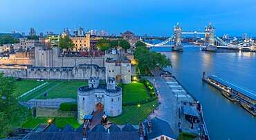 View of Tower Bridge and the Tower of London, UNESCO World Heritage Site, from Cheval Three Quays at dusk, London, England, United Kingdom, Europe