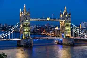 View of Tower Bridge from Cheval Three Quays at dusk, London, England, United Kingdom, Europe