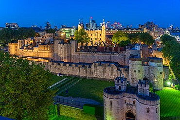 View of the Tower of London, UNESCO World Heritage Site, from Cheval Three Quays at dusk, London, England, United Kingdom, Europe