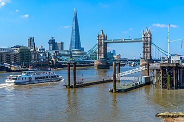 View of Tower Bridge and The Shard with tour boat on the River Thames, London, England, United Kingdom, Europe