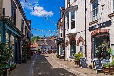 View of shops and cafes on Kirkgate, Ripon, North Yorkshire, England, United Kingdom, Europe