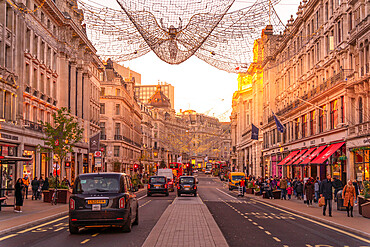 View of red buses and taxis on Regent Street at Christmas, London, England, United Kingdom, Europe