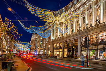 View of Christmas lights and shops on Regent Street at Christmas, London, England, United Kingdom, Europe