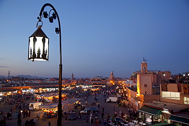 View over market square at dusk, Place Jemaa El Fna, Marrakesh, Morocco, North Africa, Africa