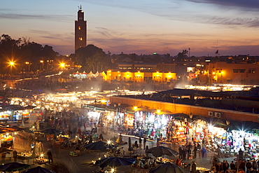 View over market square at dusk, Place Jemaa El Fna, Marrakesh, Morocco, North Africa, Africa