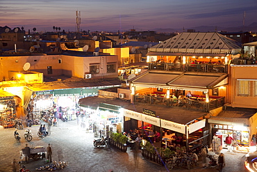 View over market square at dusk, Place Jemaa El Fna, Marrakesh, Morocco, North Africa, Africa