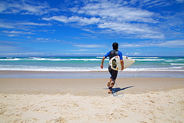 Surfers Paradise, Surfer heading for the sea, Gold Coast, Queensland, Australia, Oceania