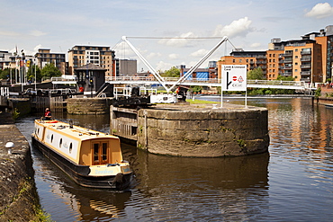 Narrowboat navigating Leeds Lock No 1 Aire and Calder Navigation, Leeds, West Yorkshire, Yorkshire, England, United Kingdom, Europe