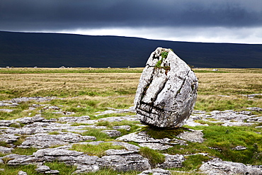 Dark clouds and Standing Stone on Twisleton Scar, Yorkshire Dales, North Yorkshire, Yortkshire, England, United Kingdom, Europe