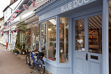 Row of independent shops with bicycle in Clare, Suffolk, England, United Kingdom, Europe