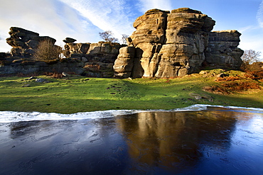 Gritstone formations at Brimham Rocks reflected in frozen flood water Summerbridge, North Yorkshire, Yorkshire, England, United Kingdom, Europe