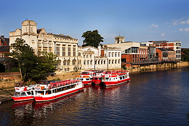 River boats moored on the River Ouse at The Guildhall, City of York, Yorkshire, England, United Kingdom, Europe