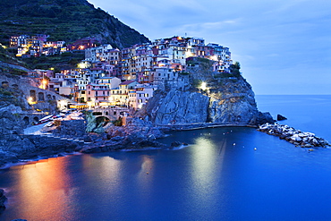 The Cinque Terre village of Manarola at dusk, Cinque Terre, UNESCO World Heritage Site, Liguria, Italy, Mediterranean, Europe