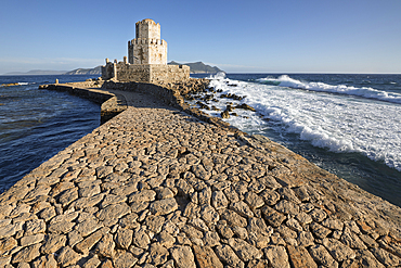 Bourtzi octagonal tower of Methoni Castle and the stone bridge in stormy sea, Methoni, Messenia, Peloponnese, Greece, Europe