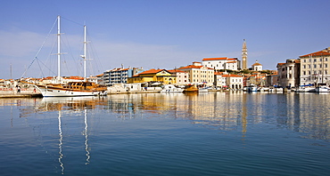 Looking over Piran Harbour towards Tartini Square and the Church of St. George, Piran, Slovenia, Europe