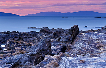 Sunset over Skye from the Isle of Eigg, Inner Hebrides, Scotland, United Kingdom, Europe