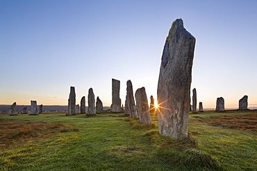 The sun rises at Callanish stone circle, Isle of Lewis, Outer Hebrides, Scotland, United Kingdom, Europe