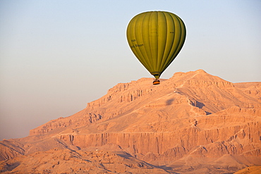 Hot air balloon suspended over the Theban hills of Luxor, Thebes, Egypt, North Africa, Africa