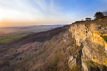 The setting sun illuminates Whitestone Cliff at Sutton Bank, North Yorkshire, Yorkshire, England, United Kingdom, Europe