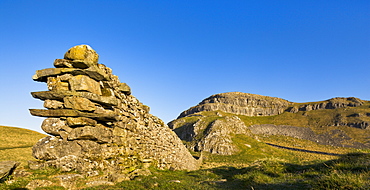 Drystone wall beneath Attermire Scar at sunrise, Settle, North Yorkshire, Yorkshire, England, United Kingdom, Europe