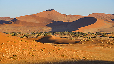 Looking towards the dunes of Sossusvlei, with two tiny figures on the lower ridge of the dune, Namib Naukluft, Namibia, Africa