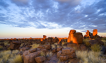 Boulders and grasses at sunrise, Giant's Playground, Keetmanshoop, Namibia, Africa 