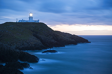 Strumble Head Lighthouse at dusk, Pembrokeshire Coast National Park, Wales, United Kingdom, Europe