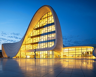 Exterior of Heydar Aliyev Building at night, designed by Zaha Hadid, Baku, Azerbaijan, Central Asia, Asia