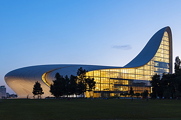 Exterior of Heydar Aliyev Building at night, designed by Zaha Hadid, Baku, Azerbaijan, Central Asia, Asia