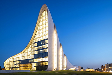 Exterior of Heydar Aliyev Building at night, designed by Zaha Hadid, Baku, Azerbaijan, Central Asia, Asia