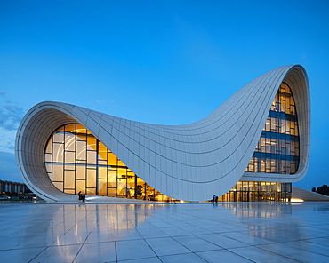 Exterior of Heydar Aliyev Building at night, designed by Zaha Hadid, Baku, Azerbaijan, Central Asia, Asia