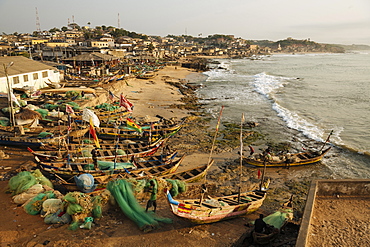 Fishermen with boats at dawn, Cape Coast, Ghana, Africa