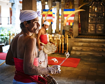 Drummer during Puja, Temple of the Sacred Tooth Relic, Kandy, Central Province, Sri Lanka, Asia